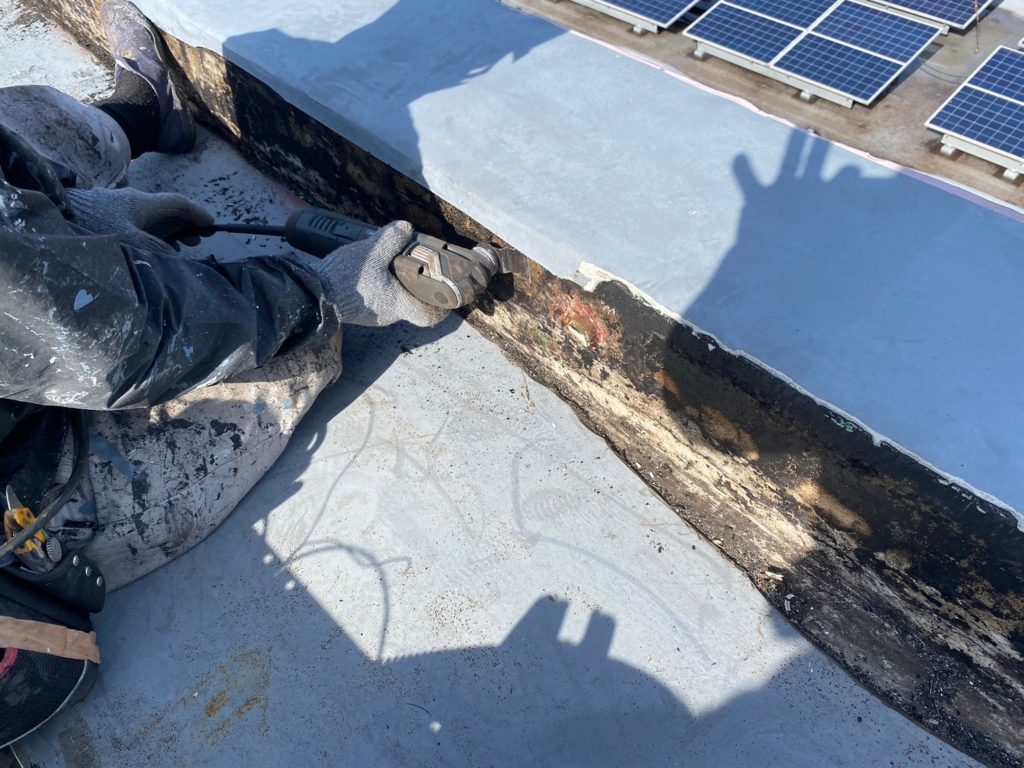 防水塗膜浮部の除去